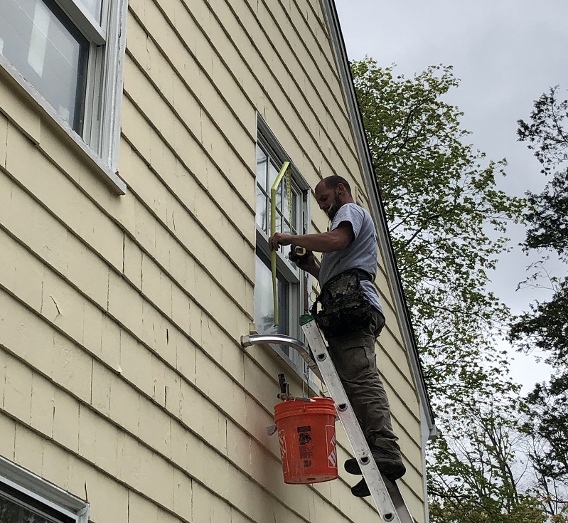 Finishing the exterior of the Andersen replacment windows 